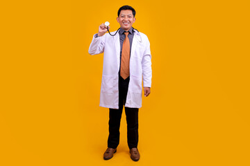 Smiling Asian Male Doctor Holding a Stethoscope, Posing Professionally