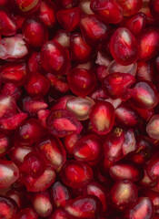 red pomegranate seeds background