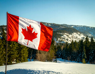 A Canadian flag with its red maple leaf symbol waves proudly against a clear blue sky over snow-covered mountains