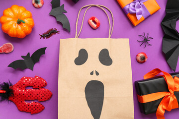 Composition with shopping bag, decorations and gifts for Halloween on color background