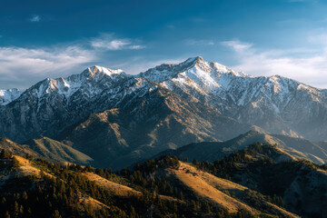 Majestic mountain range shines under golden hour light