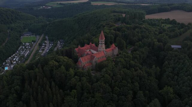 Clervaux, the Abbey of Saint Maurice and Saint Maur, plus the small mountain village setting in northern Luxembourg. Aerial view.
