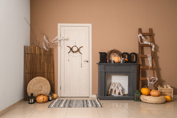 Interior of hallway decorated for Halloween with door, mantelpiece and ladder
