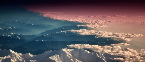 Aerial view of snow-capped mountains and clouds