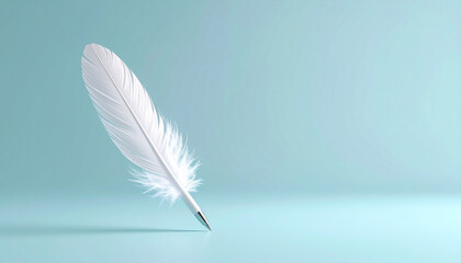 Obraz premium A delicate single feather quill placed on a soft blue-gray background, evoking themes of creativity, learning, and gentle thought