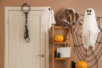 Interior of hall decorated for Halloween with door and shelf unit