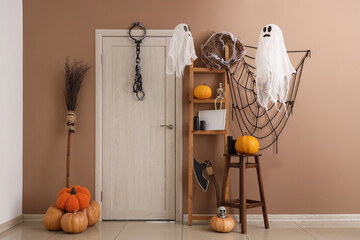 Interior of hall decorated for Halloween with door and shelf unit