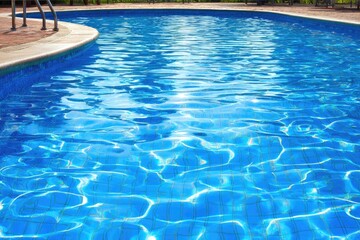 Obraz premium Pool water ripples and sunlit tiles