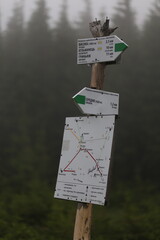 Carpathian Trail Signs on Tin Plates in Mountain Fog