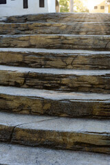 Sunlight illuminating stone steps leading upward, creating a sense of ascension and progress