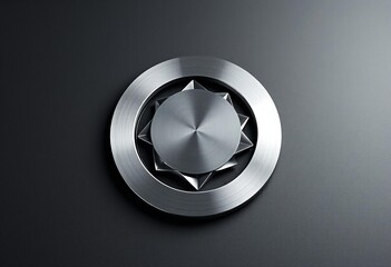 Brushed metal circular emblem with starburst center