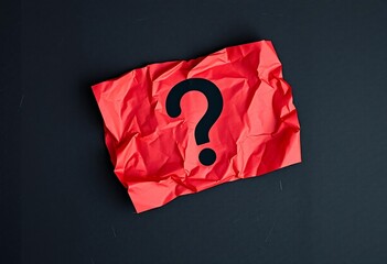 Red crumpled paper with black question mark red paper