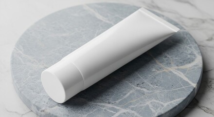 A white tube lies on a gray marble platform