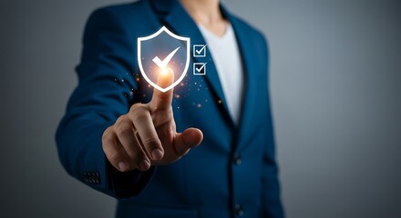 Man in Blue Suit Interacting with Digital Security Shield and Checklist Display for Cyber Protection and Data Integrity