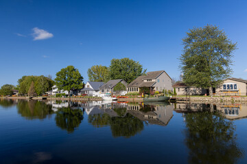 Scenic Michigan village along lake Huron back waters near Bay city during summer day