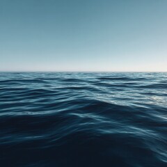 Obraz premium Realistic photograph of an expansive ocean, its surface calm and blue with small waves, under clear skies. The water should have gentle ripples with the horizon stretching out to.