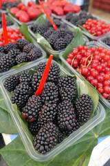 Fresh berries displayed at a local market in summer