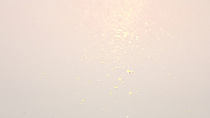 Obraz premium Soft Pink Background with Scattered Gold Glitter: Elegant, Festive, and Delicate Texture.
