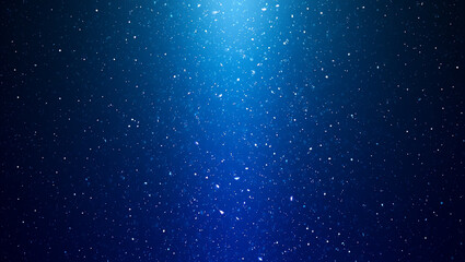 Obraz premium Abstract Blue Background: Sparkling Particles, Glowing Light, Festive Winter Mood