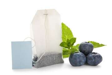 Tea bag, mint leaves and blueberry isolated on white background, closeup