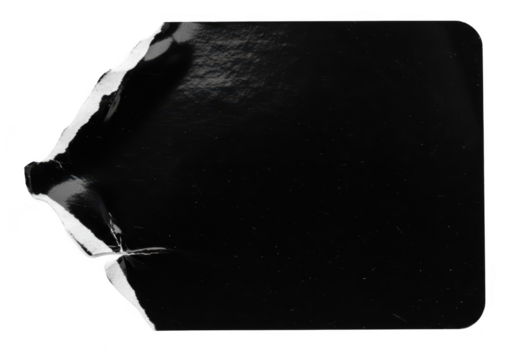 A blank glossy black sticker with a torn corner and ripped edge is isolated on a transparent background providing ample copy space for design elements