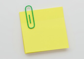 Bright yellow sticky note held by a vibrant green paperclip on a neutral background
