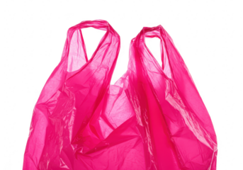 A closeup view of a bright pink crinkled plastic shopping bag with handles is shown against a plain transparent background highlighting its texture