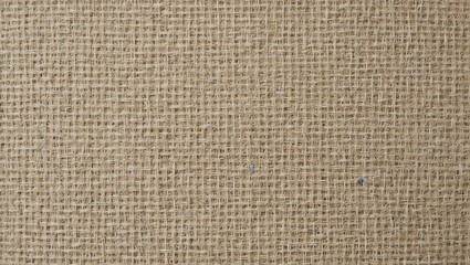 Fototapeta premium A close-up view of a natural burlap texture, showcasing its rugged fibers and earthy tones for versatile design use.