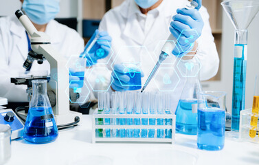Scientists in a high tech lab conduct research with pipettes and tablets, blending medical...