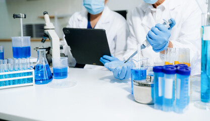 Fototapeta premium Scientist team meeting and writing analysis results in the laboratory study and analyze scientific sample