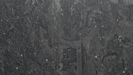 A textured black surface with unique patterns and subtle glitter, perfect for backgrounds or design elements.