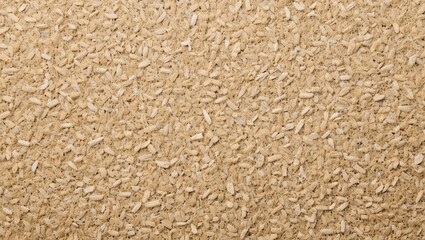 Close-up of a finely textured surface of grains, showcasing natural colors and organic patterns.