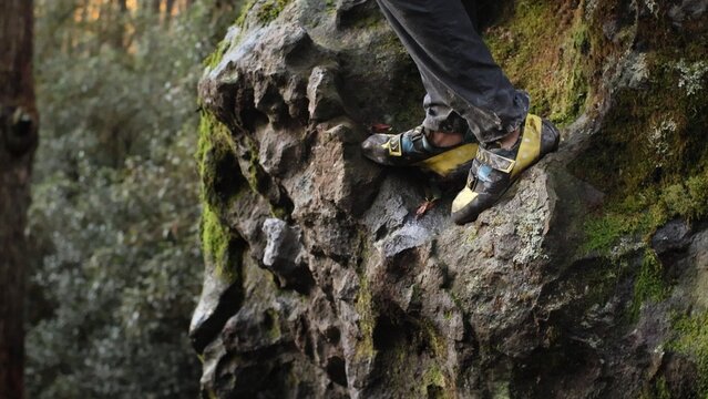 Climber on a dirty boulder