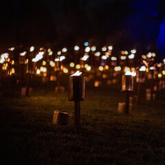 Tourches with open flame at night