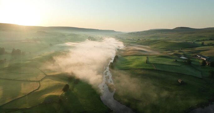 Aerial shot of foggy valley in Yorkshire Dales