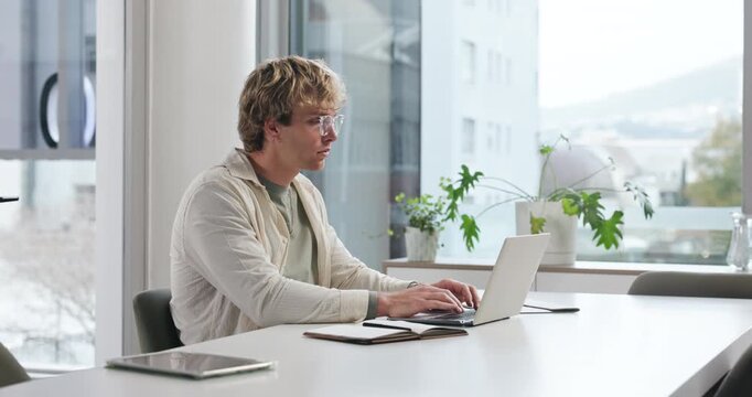 Creative, man and typing on laptop at agency for news report, editing publication or story research. Content writer, planning and tech for writing article draft, proofreading or newsletter submission