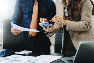 Team business meeting presentation. Hand businessman working project in modern office.Laptop computer and tablet and smart phone