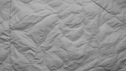 Textured crumpled paper background suitable for various creative design projects and presentations.