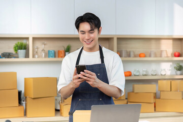 E-commerce. Happy employee checking smartphone in shipping area.
