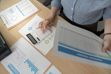Accounting Professional Analyzing Financial Data with Calculator