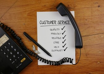 Checklist for Excellent Customer Service with Phone and Pen on Desk