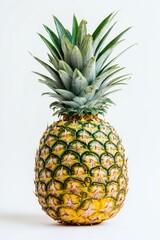Fototapeta premium Fresh ripe pineapple standing upright on white background with natural texture and bright tropical color