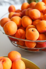 ripe, juicy apricots in bowls, preparation of apricots for jam