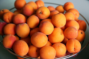 ripe, juicy apricots in bowls, preparation of apricots for jam