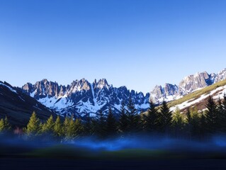 Snowy mountain range with mist