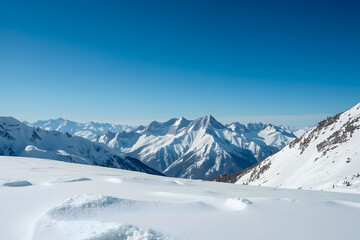 Panoramic view of a majestic snow-covered mountain range under a crisp blue sky