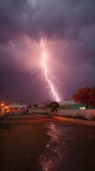 Stormy night, lightning strike over houses