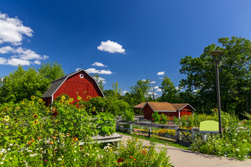 Red Barn and flower garden during summer day in Frederik Meijer Gardens in Grand Rapids, Michigan