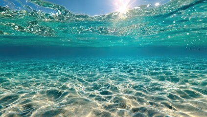 Fototapeta premium Underwater view of sunlit turquoise water over sand