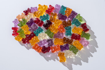 The human brain is made of sweet jelly bears. Concept: mental health, learning, brain development, new skills, psychological health, proper nutrition, glucose for the brain.
